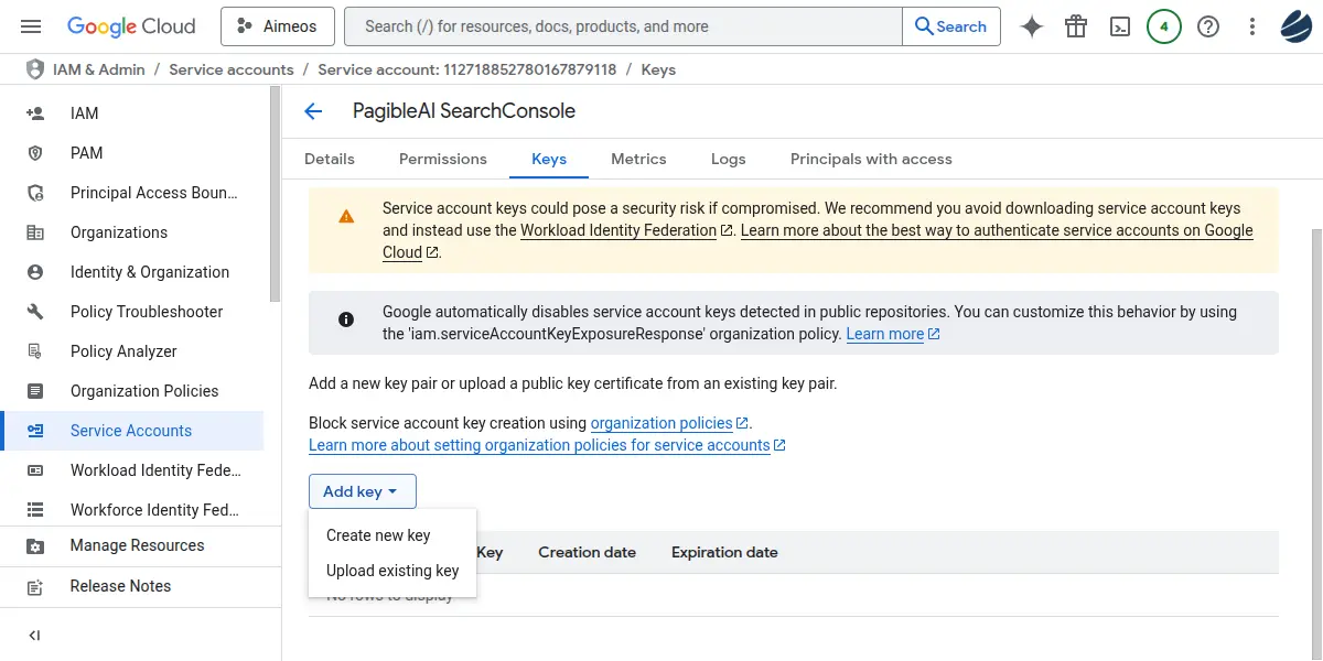 Google Cloud console displaying the "Keys" tab for a service account, with warnings about key security risks and options to add new keys.